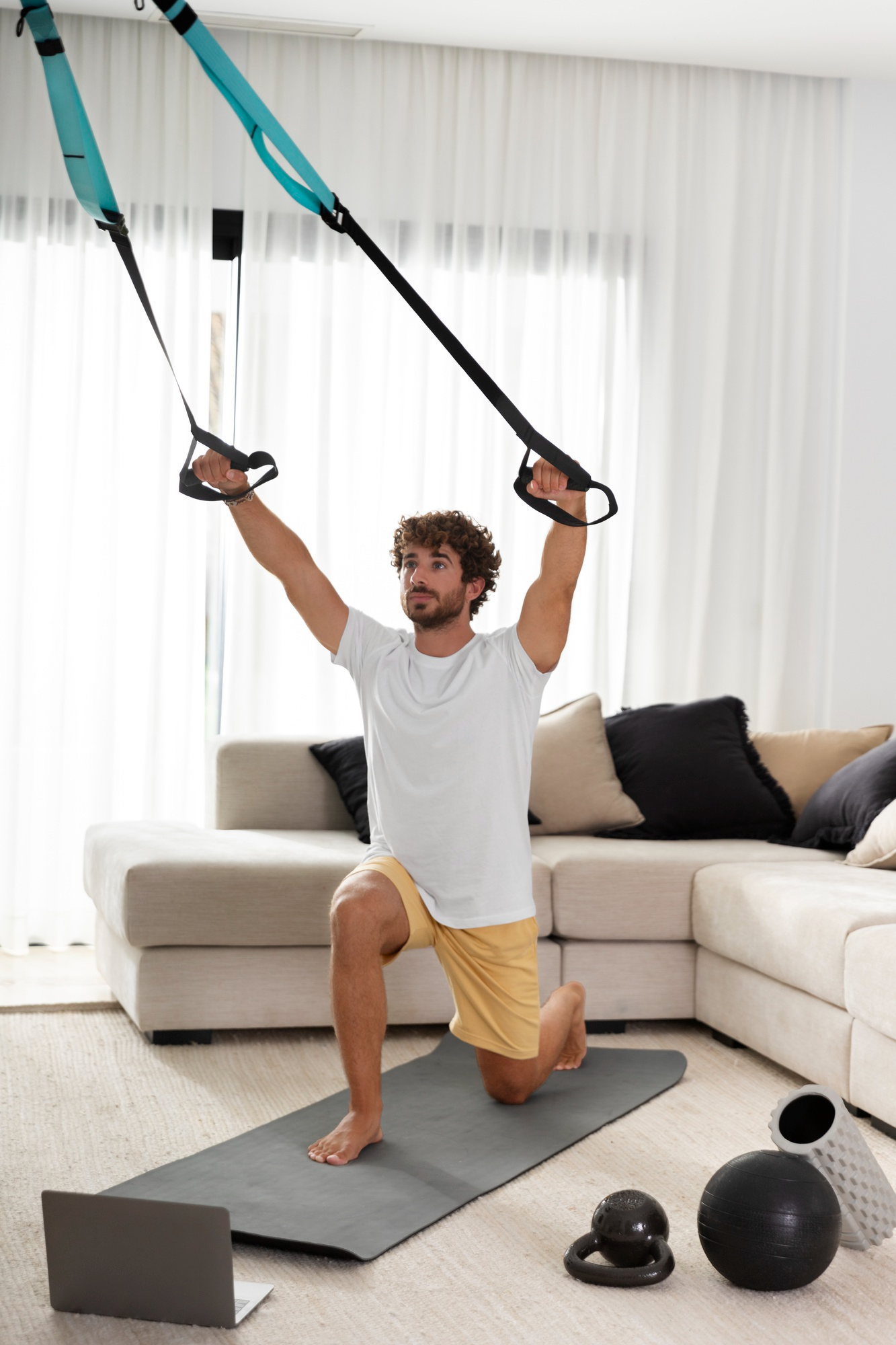 Person exercising with suspension trainer